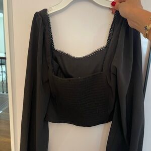 A black cropped shirt from pacsun